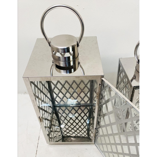 395 - LANTERNS, a graduated set of three, polished metal with lattice design, largest 45cm H x 23cm x 23cm... 