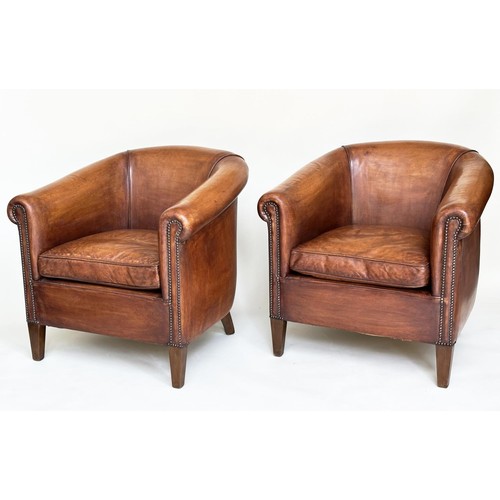 260 - TUB ARMCHAIRS, a pair, brass studded hand finished soft tan brown leather with bow backs and taperin... 