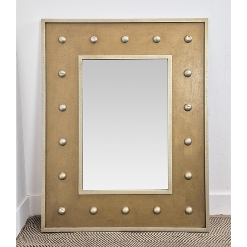 176 - LOOKING GLASS, of gilt finish and hemispherical decoration, 107cm x 84cm.