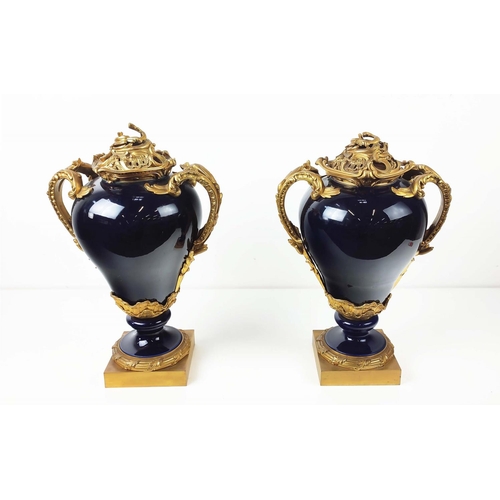 18 - ORMOLU MOUNTED VASES, a pair, Louis XV style, cobalt blue porcelain with rococo style ormolu mounts ... 