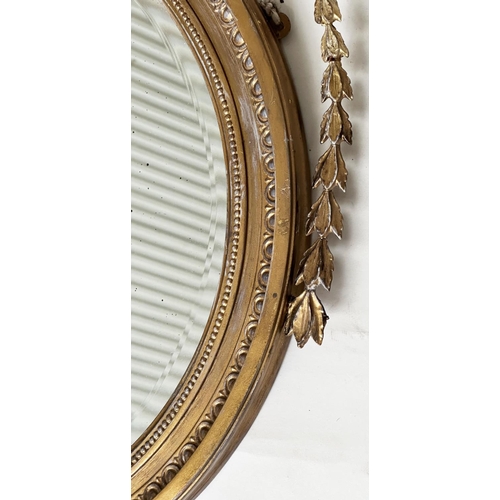 183 - ADAM STYLE MIRROR, early 20th century Robert Adam style giltwood and gesso, circular with bell husk ... 