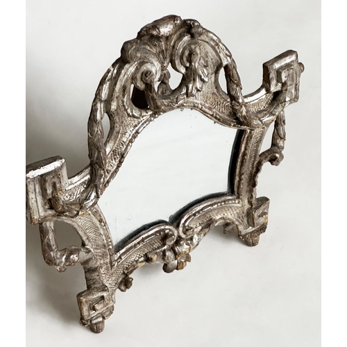 185 - TOILET MIRROR, 18th century Italian silvered and carved wood, rectangular with scroll frame and ease... 