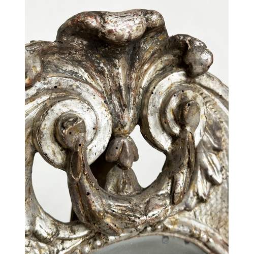 185 - TOILET MIRROR, 18th century Italian silvered and carved wood, rectangular with scroll frame and ease... 