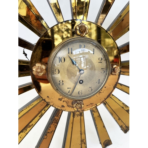 239 - ART DECO WALL CLOCK, sunburst form mirror facetted with central circular dial and eight day French m... 