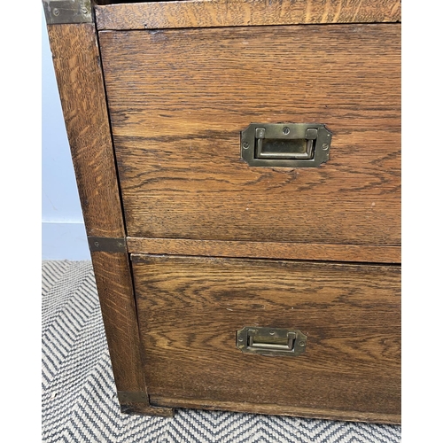 278 - CAMPAIGN CHEST, early 20th century oak, having two short and three long drawers with brass recessed ... 