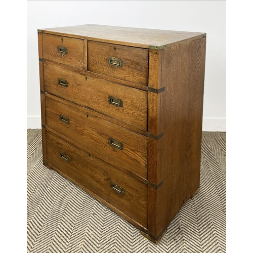 278 - CAMPAIGN CHEST, early 20th century oak, having two short and three long drawers with brass recessed ... 