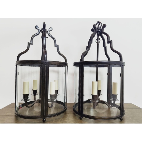 548 - CHARLES EDWARDS WHITEHALL LANTERNS, a pair, bronze and glass, 58cm H x 29cm D. (2)