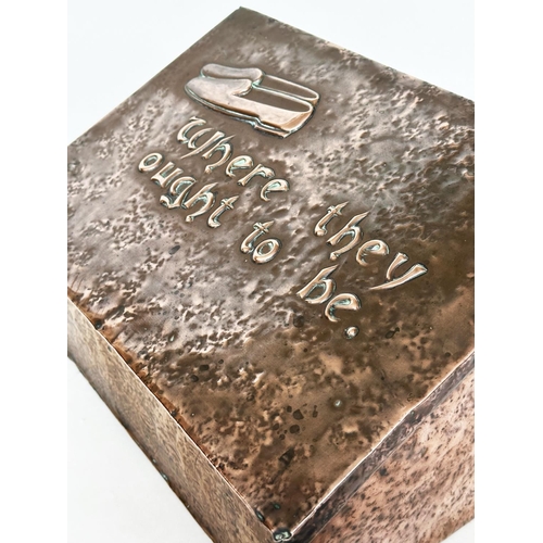 556 - SLIPPER  BOX, early 20th century Newlyn style hammered copper with sloping rising lid and baize inte... 