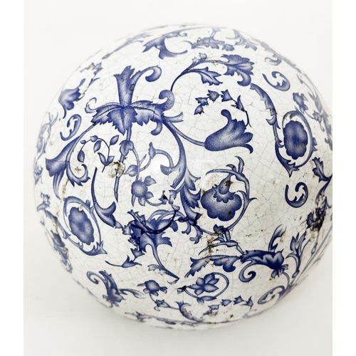 557 - BLUE/WHITE CERAMICS, three early 19th century Dutch crackle glazed blue/white graduated balls, toget... 