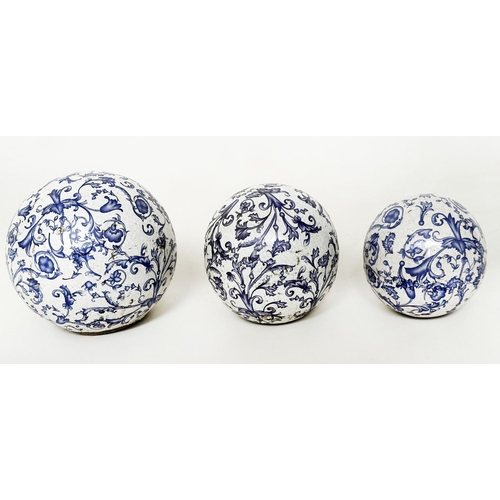 557 - BLUE/WHITE CERAMICS, three early 19th century Dutch crackle glazed blue/white graduated balls, toget... 