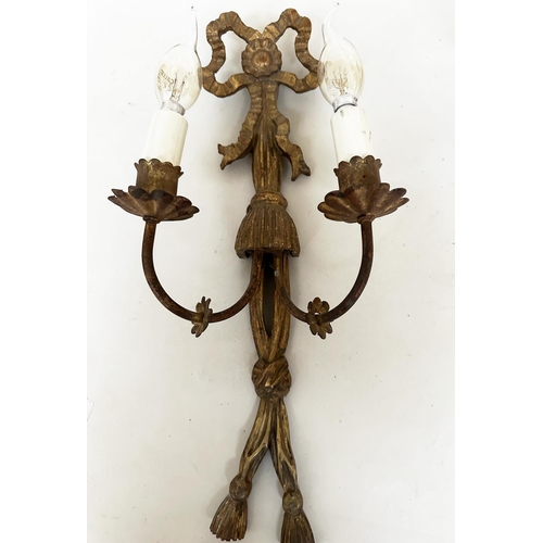 570 - WALL LIGHTS, a pair, carved giltwood each with bow crest and two branch candelabra, together with a ... 