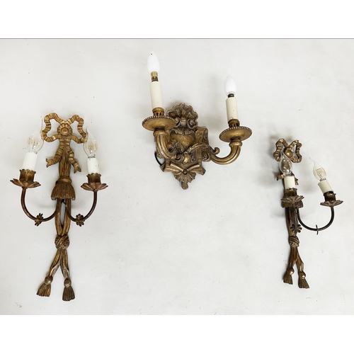 570 - WALL LIGHTS, a pair, carved giltwood each with bow crest and two branch candelabra, together with a ... 