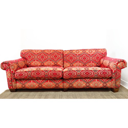 614 - MODULAR SOFA, two parts, in red kilim patterned chenille, 98cm H x 226cm W x 114cm D overall.