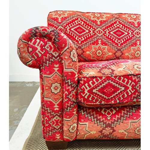 614 - MODULAR SOFA, two parts, in red kilim patterned chenille, 98cm H x 226cm W x 114cm D overall.