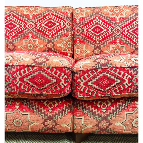 614 - MODULAR SOFA, two parts, in red kilim patterned chenille, 98cm H x 226cm W x 114cm D overall.