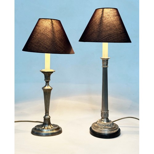 573 - TABLE LAMPS, silvered metal with reeded column together with another silvered metal and reeded colum... 