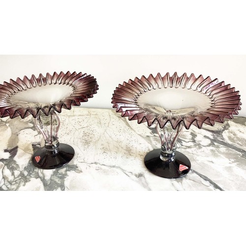 67 - MURANO GLASS TAZZE, a pair, ruffle rimmed circa 1950, clear and aubergine on pierced stem and spread... 