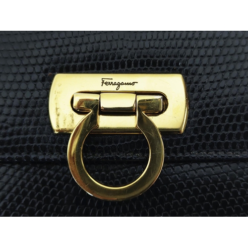 11 - SALVATORE FERRAGAMO VINTAGE SHOULDER BAG/CLUTCH, with gancini iconic front flap closure, black leath... 