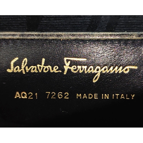 11 - SALVATORE FERRAGAMO VINTAGE SHOULDER BAG/CLUTCH, with gancini iconic front flap closure, black leath... 