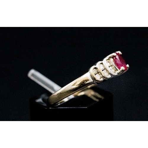 135 - AN 18CT WHITE GOLD ART DECO STYLE RUBY AND DIAMOND SET DRESS RING, the central mixed cut ruby flanke... 