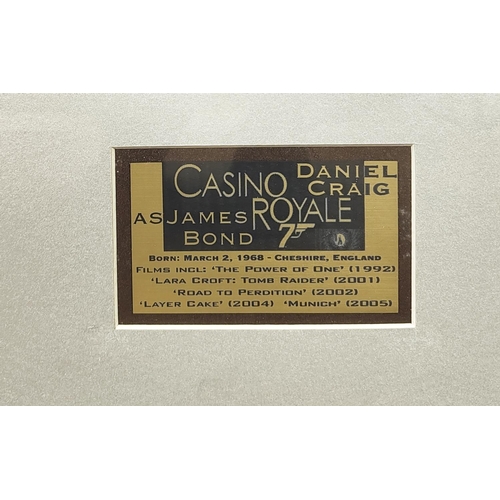 210 - DANIEL CRAIG, Casino Royale, signed presentation of two photographs and a presentation plaque in fra... 