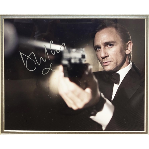 210 - DANIEL CRAIG, Casino Royale, signed presentation of two photographs and a presentation plaque in fra... 