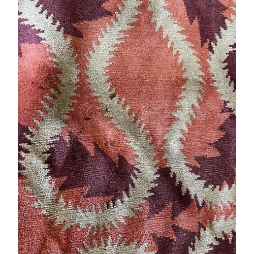 244 - THE RUG COMPANY CARPET, 370cm x 274cm, 'Squiggle Orange' designed by Vivienne Westwood.