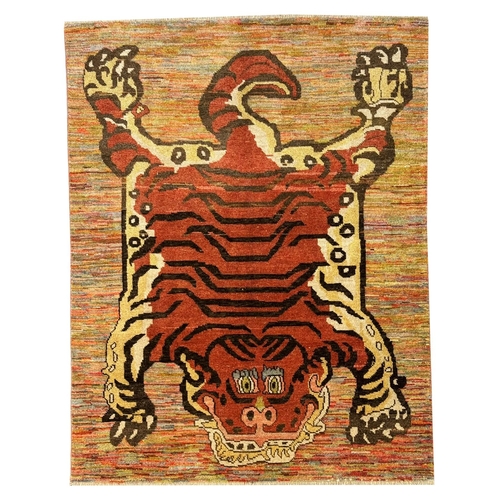 254 - FINE TIBETAN TIGER CARPET, 227cm x 173cm.