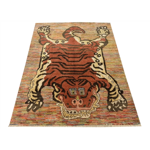 254 - FINE TIBETAN TIGER CARPET, 227cm x 173cm.