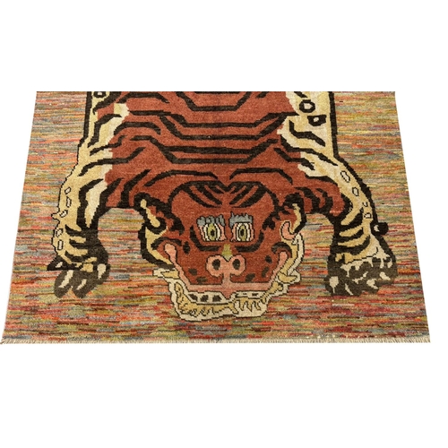 254 - FINE TIBETAN TIGER CARPET, 227cm x 173cm.