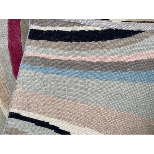 255 - THE RUG COMPANY CARPET, 184cm x 129cm, 'Swirl' designed by Paul Smith.