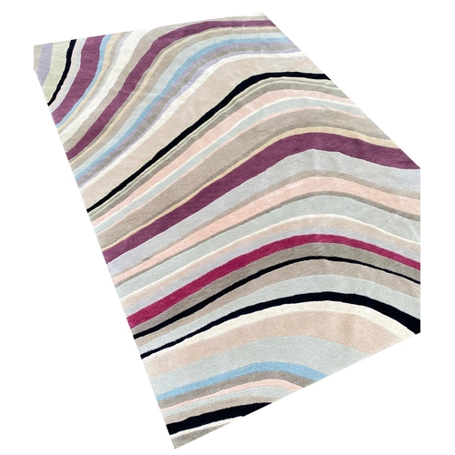 255 - THE RUG COMPANY CARPET, 184cm x 129cm, 'Swirl' designed by Paul Smith.