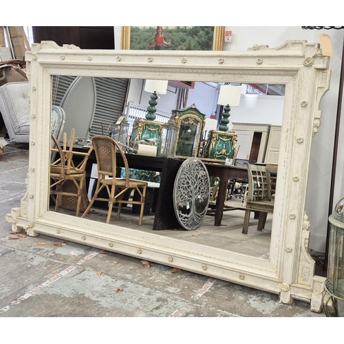 279 - WALL MIRROR, Victorian grey painted with rosette and cruciform cornered frame, 144cm H x 253cm.