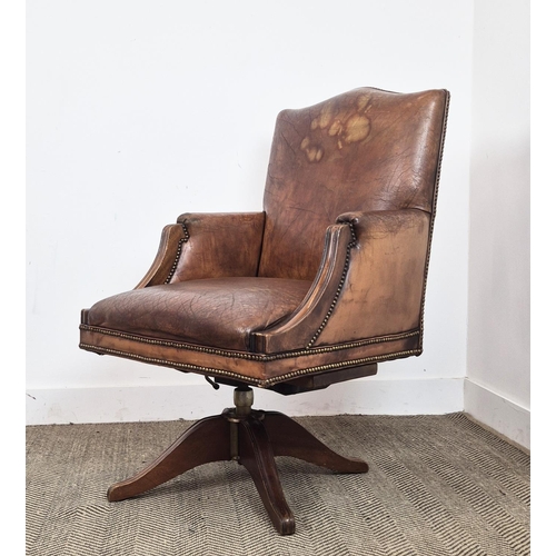 280 - DESK CHAIR, vintage tan leather with swivel and slightly reclining seat, 103cm H x 66cm W.