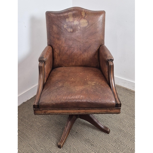 280 - DESK CHAIR, vintage tan leather with swivel and slightly reclining seat, 103cm H x 66cm W.