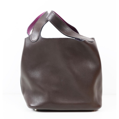 37 - HERMÈS PICOTIN 18 EBENE BARENIA BUCKET BAG, 2005, brown and purple leather, with drawstring closure ... 