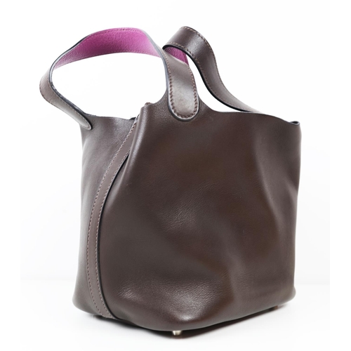 37 - HERMÈS PICOTIN 18 EBENE BARENIA BUCKET BAG, 2005, brown and purple leather, with drawstring closure ... 