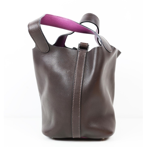 37 - HERMÈS PICOTIN 18 EBENE BARENIA BUCKET BAG, 2005, brown and purple leather, with drawstring closure ... 