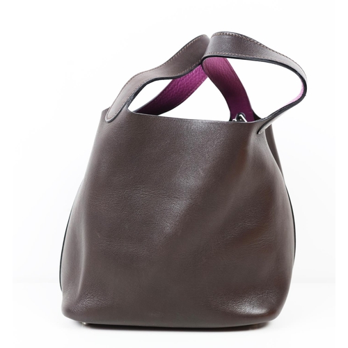 37 - HERMÈS PICOTIN 18 EBENE BARENIA BUCKET BAG, 2005, brown and purple leather, with drawstring closure ... 