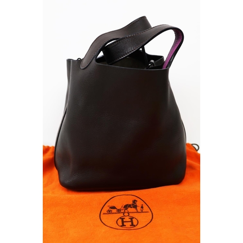 37 - HERMÈS PICOTIN 18 EBENE BARENIA BUCKET BAG, 2005, brown and purple leather, with drawstring closure ... 