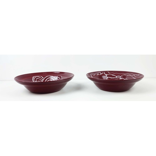 372 - PICASSO STYLE BOWLS, from the Conran Shop, a pair, ox blood, slight blemish to glaze, each 37cm W. (... 