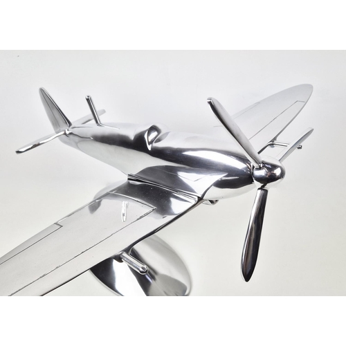 415 - CONTEMPORARY SCHOOL SCULPTURAL STUDY, of a Spitfire, polished metal, 44.5cm H approx.