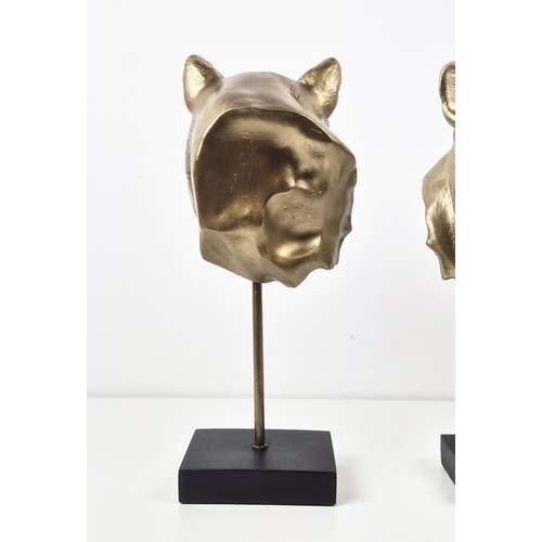 427 - SCULPTURAL PANTHA HEADS, a pair, on stands, 38.5cm H approx. (2)