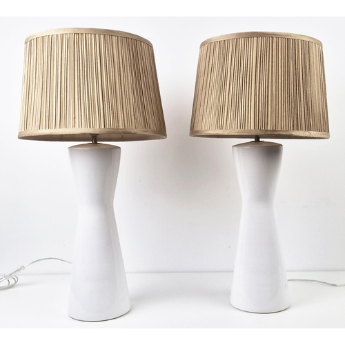 428 - TABLE LAMPS, a pair, white glazed ceramic, with shades, 66cm H approx. (2)