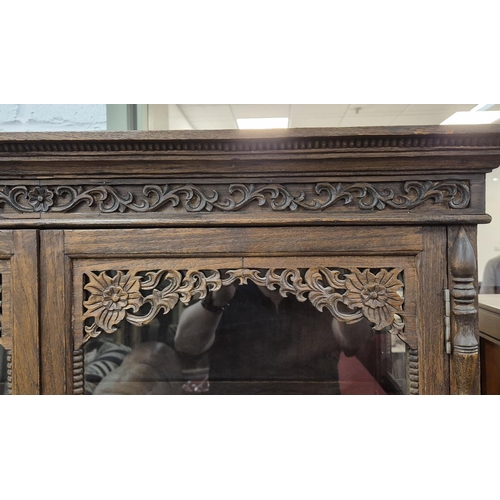 461 - THIA GLAZED CARVED TEAK CABINET, 100cm W x 171cm H x 45cm D.