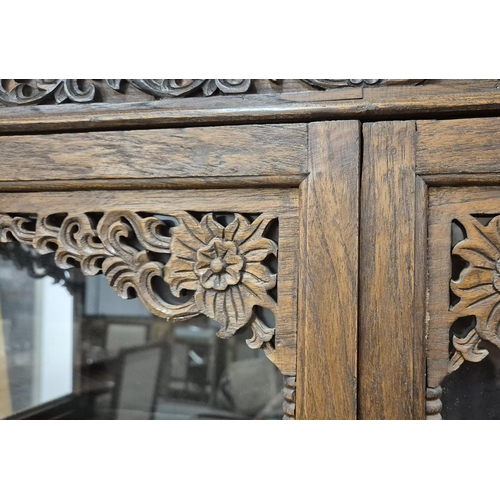 461 - THIA GLAZED CARVED TEAK CABINET, 100cm W x 171cm H x 45cm D.