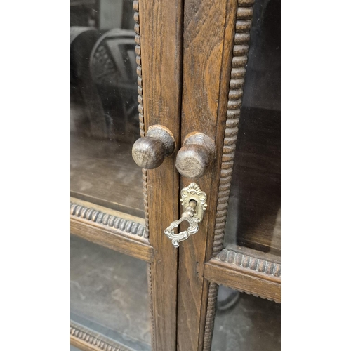 461 - THIA GLAZED CARVED TEAK CABINET, 100cm W x 171cm H x 45cm D.