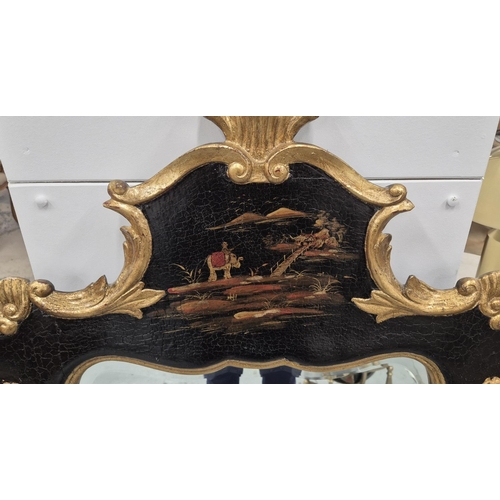 522 - CHINOISERIE MIRROR, 18th century Rococo style, in black and gilt decoration, 127cm H x 70cm W.