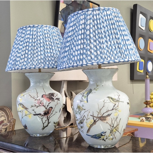 523 - TABLE LAMPS, a pair, glass bird design, with pleated shades, 71cm H. (2)