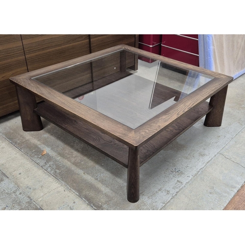 549 - COFFEE TABLE, with a glass top and wooden frame and undertier, 110cm x 110cm x 42cm H.